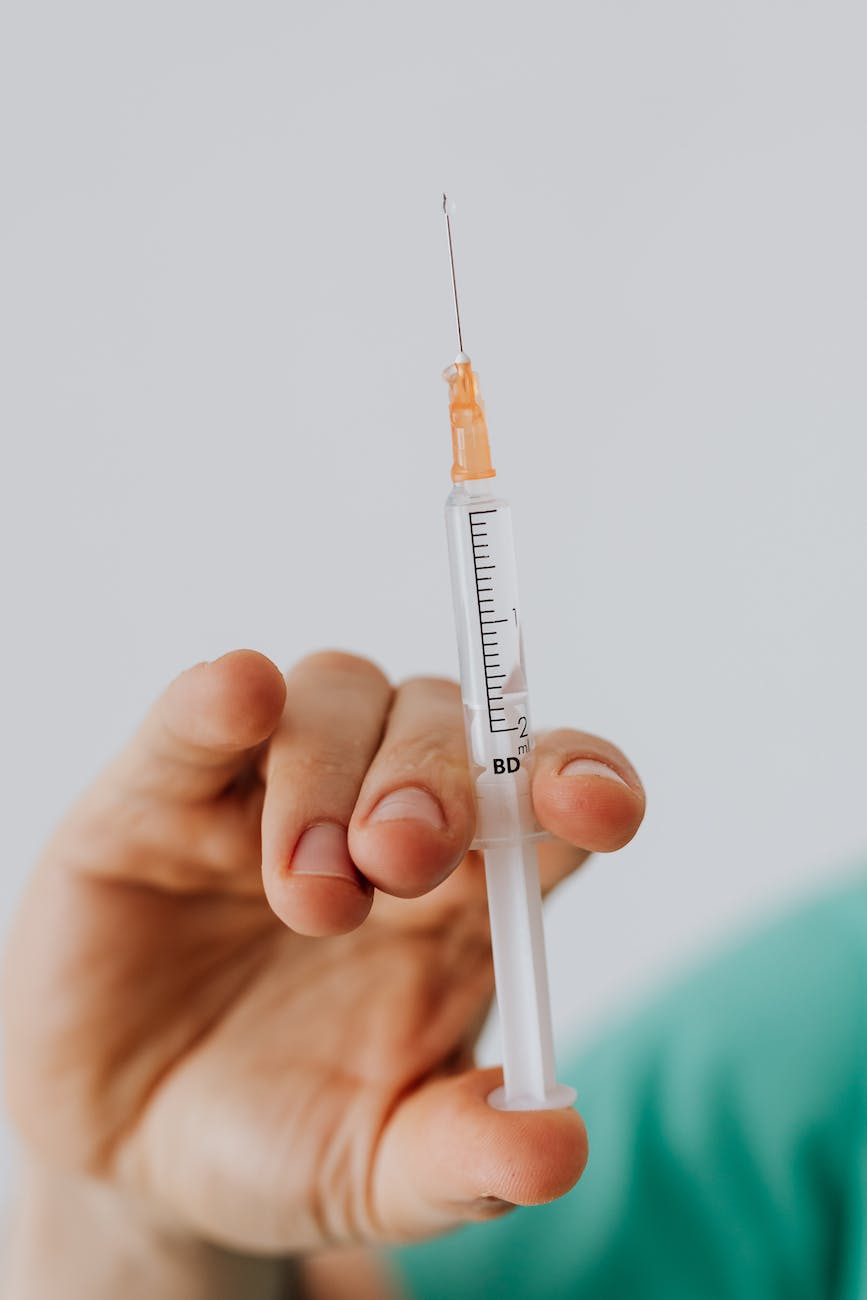 close up view of person holding a vaccine