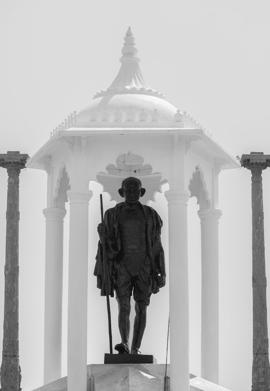 grayscale photo of a mahatma gandhi statue